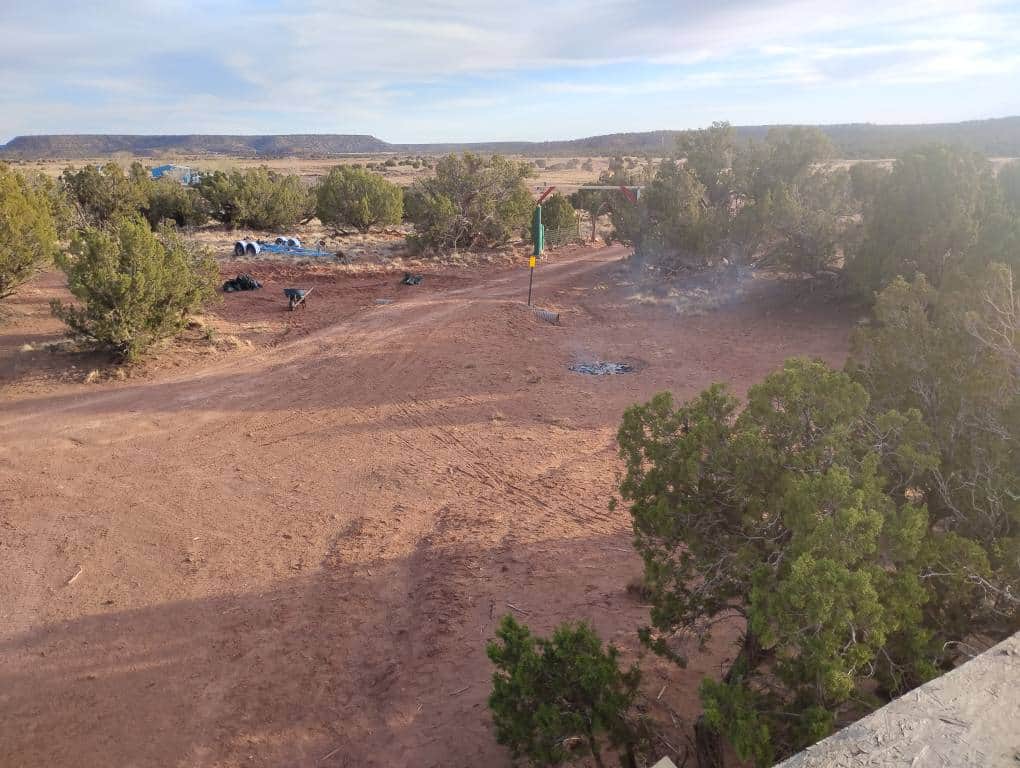 The gate at the end of the red dirt road